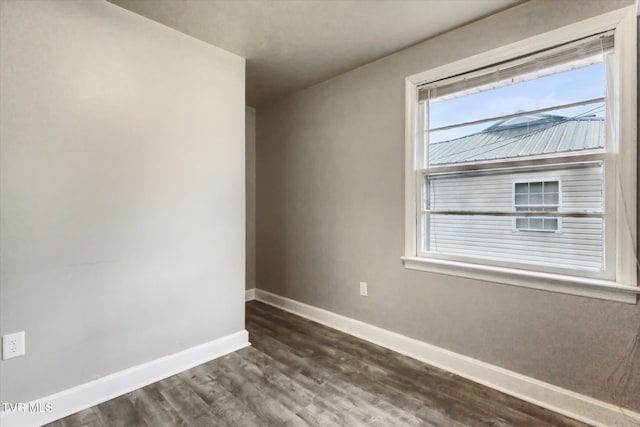 unfurnished room featuring dark hardwood / wood-style floors