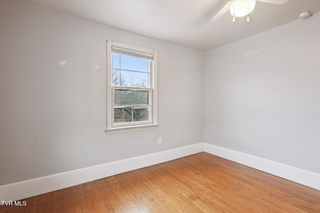 unfurnished room with ceiling fan and hardwood / wood-style floors