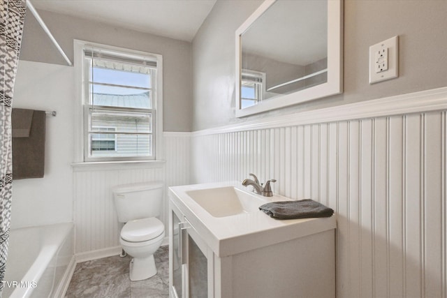 full bathroom featuring vanity, toilet, and washtub / shower combination