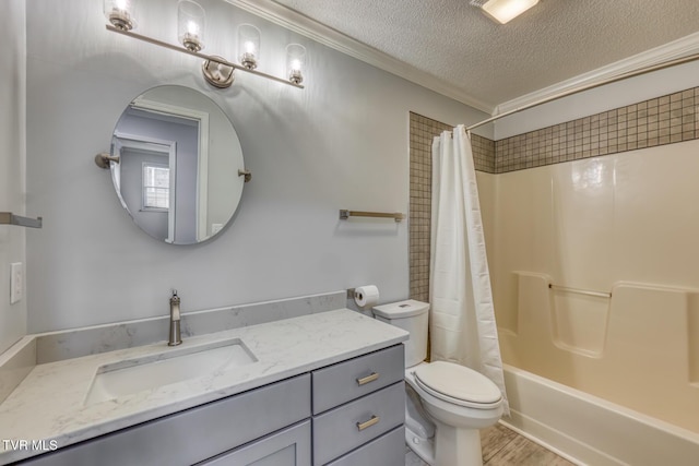 full bathroom featuring toilet, a textured ceiling, vanity, ornamental molding, and shower / bath combo with shower curtain