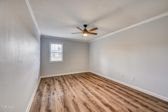 unfurnished room featuring wood-type flooring, a textured ceiling, ceiling fan, and crown molding