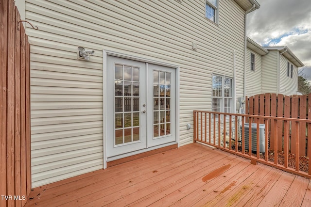 deck featuring french doors and cooling unit