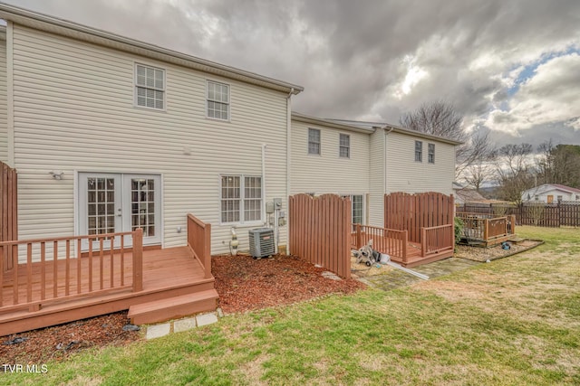 back of house featuring a yard, a deck, central air condition unit, and french doors