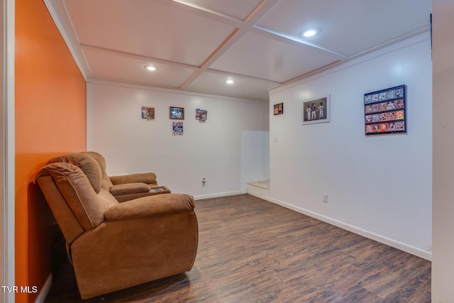 sitting room with coffered ceiling, dark wood-type flooring, and ornamental molding