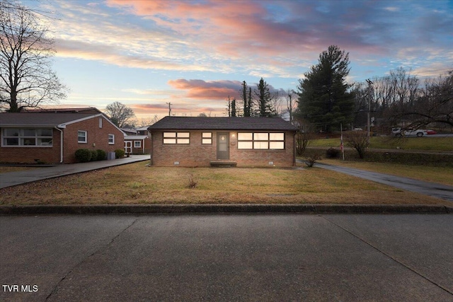 view of front of house with a lawn