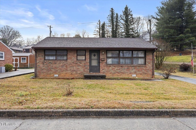 view of front of property featuring central AC and a front yard