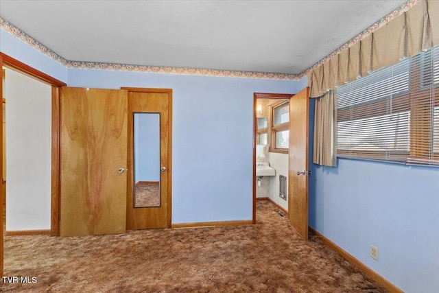 unfurnished bedroom with carpet floors