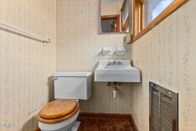 bathroom featuring sink and toilet