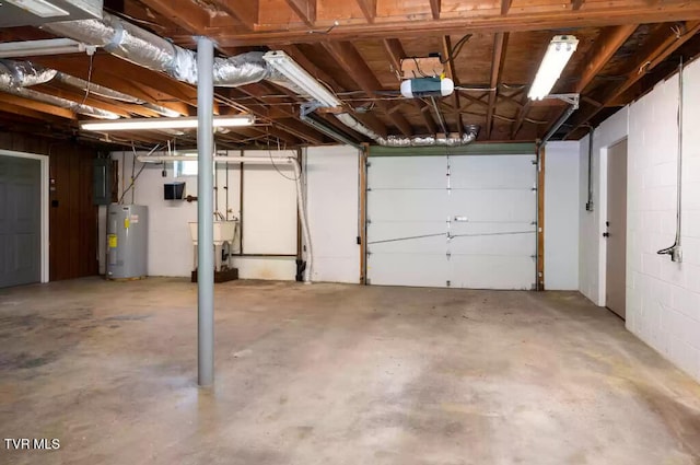 garage with a garage door opener and water heater