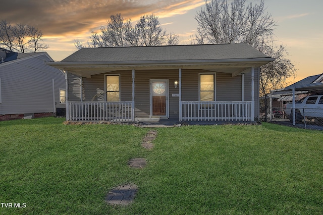 view of front of house featuring a porch and a lawn