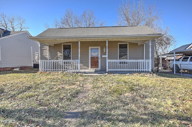 view of front facade with a porch and a front lawn