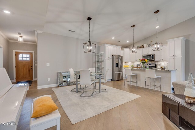 262 Harps Ln, Gray, TN 37615 - dining space featuring light wood finished floors, crown molding, baseboards, recessed lighting, and lofted ceiling