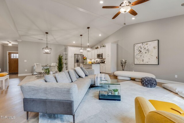 262 Harps Ln, Gray, TN 37615 - living room featuring vaulted ceiling, baseboards, a ceiling fan, light wood finished floors, and recessed lighting