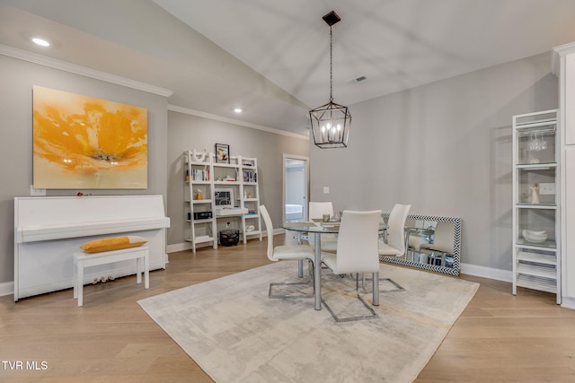 262 Harps Ln, Gray, TN 37615 - dining area with ornamental molding, a chandelier, baseboards, light wood-style flooring, and vaulted ceiling