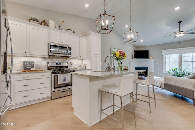 262 Harps Ln, Gray, TN 37615 - kitchen featuring appliances with stainless steel finishes, a sink, open floor plan, backsplash, and recessed lighting