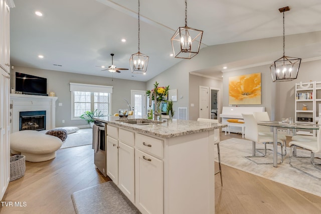 262 Harps Ln, Gray, TN 37615 - kitchen featuring open floor plan, light wood-style floors, stainless steel dishwasher, a ceiling fan, and white cabinetry