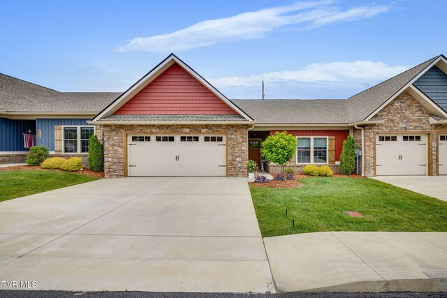 262 Harps Ln, Gray, TN 37615 - view of front of house featuring concrete driveway, stone siding, an attached garage, and a front yard