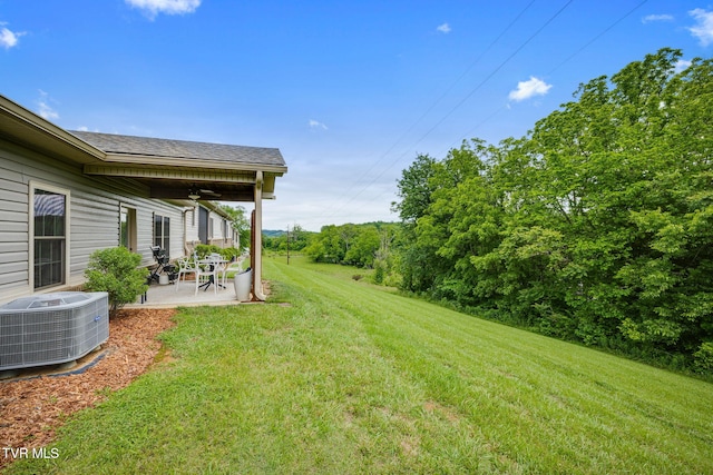 262 Harps Ln, Gray, TN 37615 - view of green lawn featuring central AC, a patio, and a ceiling fan
