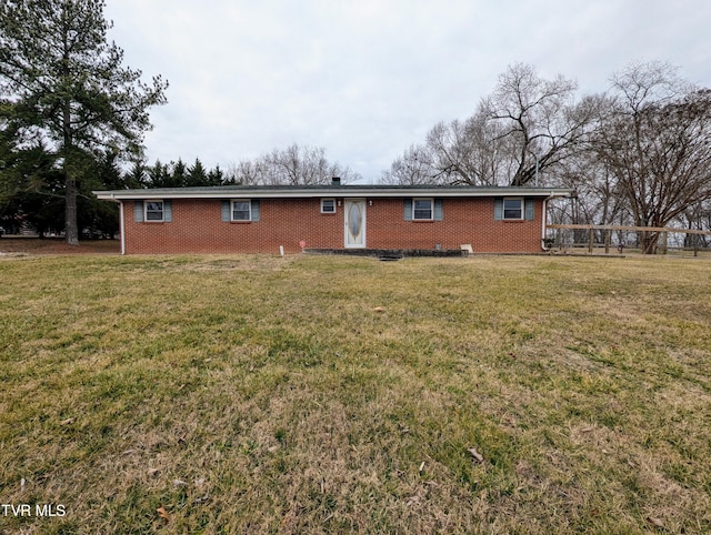 back of property featuring a lawn