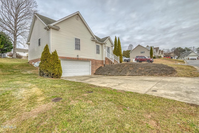 view of home's exterior with a garage and a yard