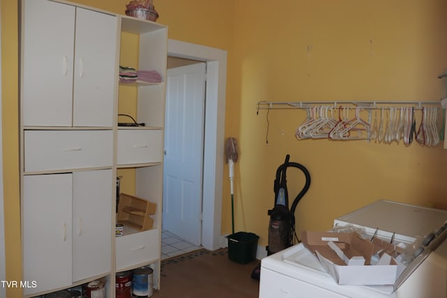 bedroom featuring washer / dryer