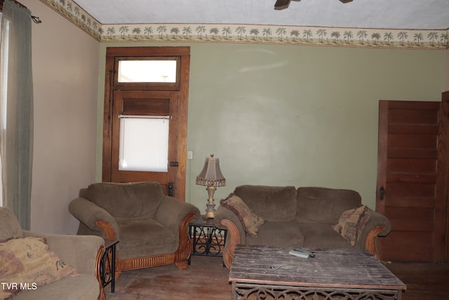 living room featuring wood-type flooring and ceiling fan