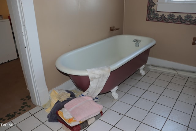 bathroom featuring a bath and tile patterned floors