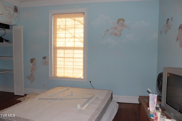 bedroom featuring multiple windows, dark wood-type flooring, and ornamental molding