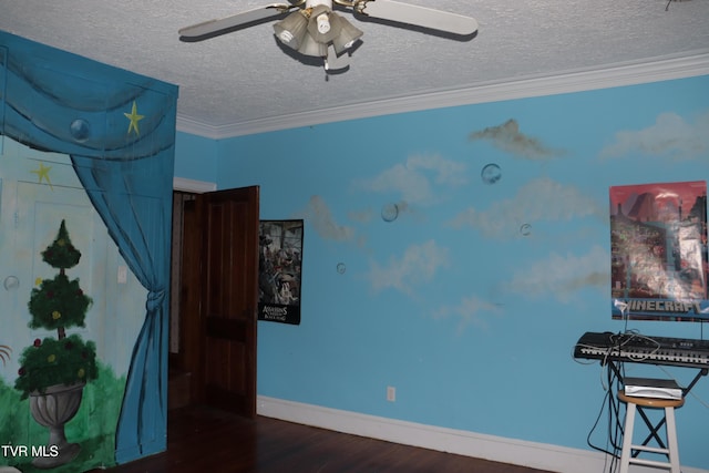 interior space featuring crown molding, ceiling fan, dark hardwood / wood-style flooring, and a textured ceiling