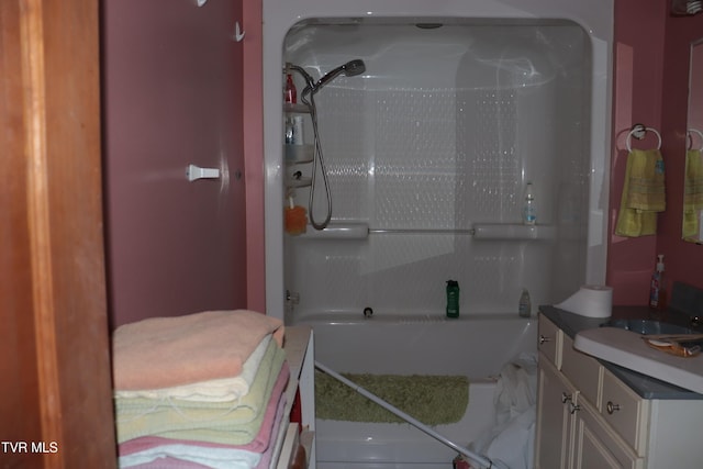 bathroom with vanity and bathing tub / shower combination