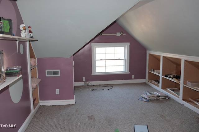 additional living space featuring light carpet and lofted ceiling