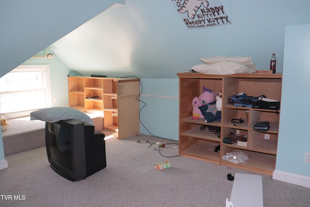 bonus room featuring lofted ceiling and light carpet