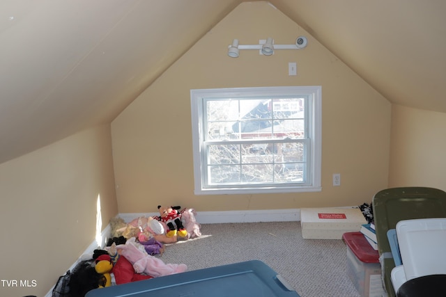 playroom featuring carpet flooring and vaulted ceiling