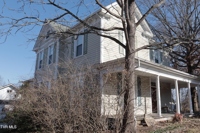 view of home's exterior with covered porch