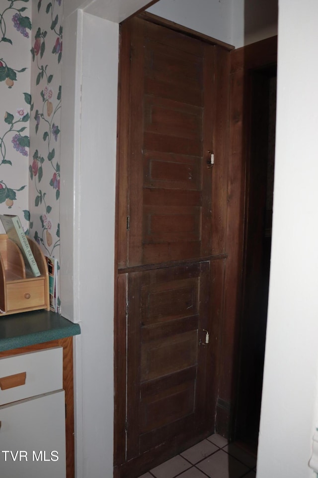 bathroom featuring tile patterned flooring and vanity