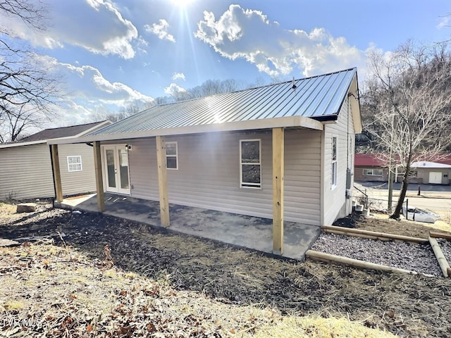 back of property featuring a patio area