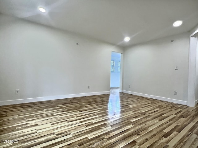 empty room with hardwood / wood-style flooring