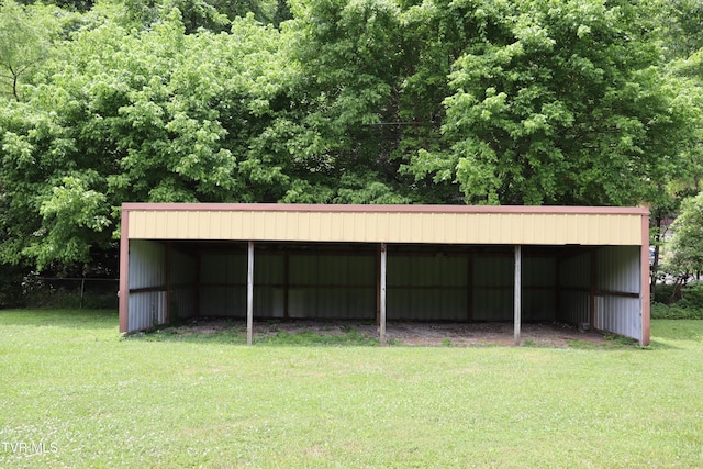 view of outbuilding with a lawn