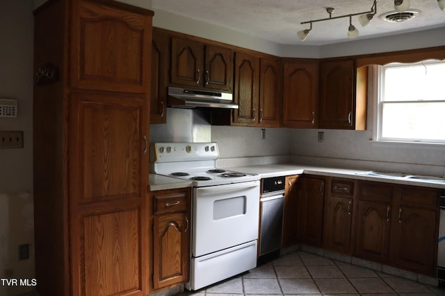 kitchen with light tile patterned flooring and white range with electric cooktop