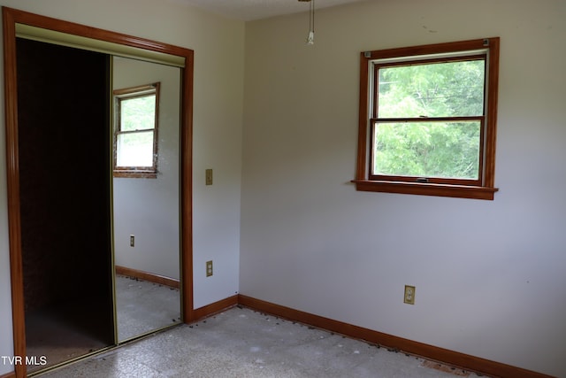 spare room with a healthy amount of sunlight