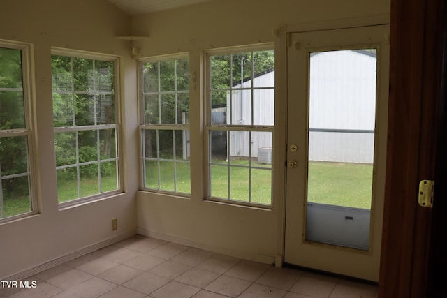 unfurnished sunroom with a wealth of natural light