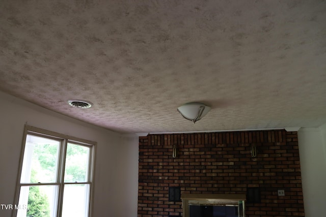 details with a textured ceiling