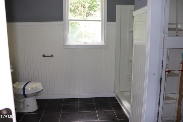 bathroom featuring tile patterned flooring and toilet