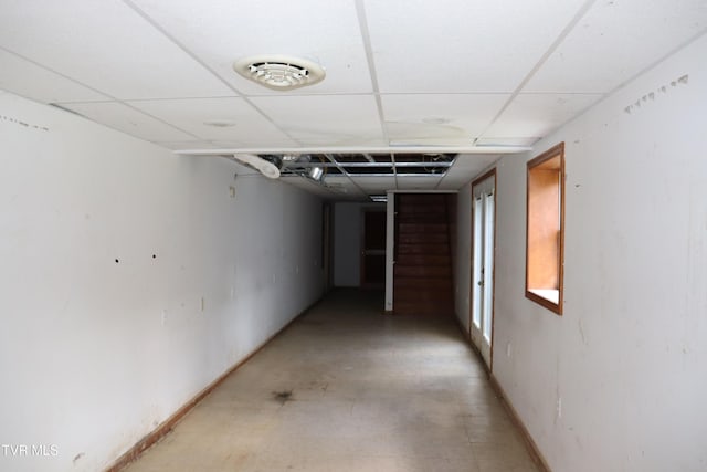 corridor featuring a paneled ceiling