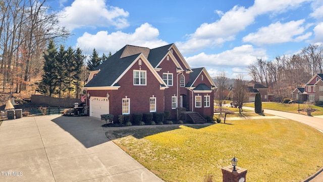 traditional home featuring a front yard, concrete driveway, and brick siding