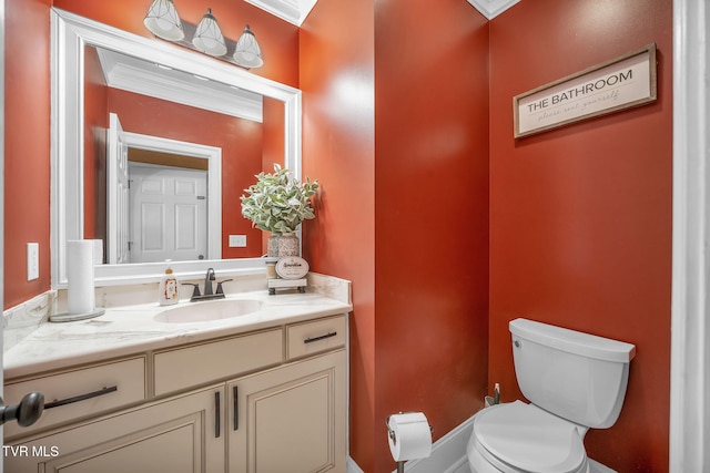 bathroom featuring toilet and vanity