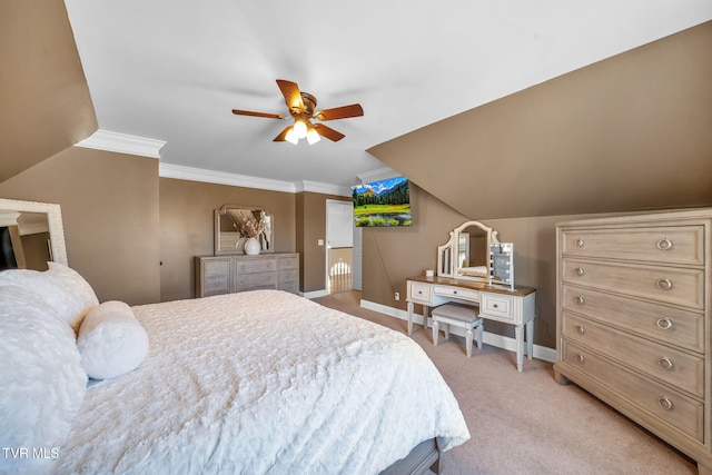 bedroom with baseboards, a ceiling fan, light colored carpet, lofted ceiling, and crown molding