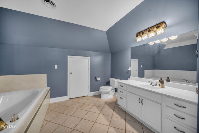 bathroom with visible vents, vaulted ceiling, vanity, baseboards, and tile patterned floors