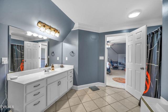 full bath with ornamental molding, vanity, baseboards, and tile patterned floors