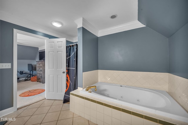 bathroom featuring vaulted ceiling, ornamental molding, a jetted tub, and tile patterned floors